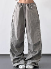 Gray drawstring wide leg cargo pants with zipper pockets and adjustable waist for comfortable casual wear