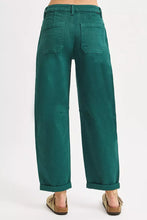 Emerald green high rise ankle cuffed wide-leg trousers with relaxed fit and rolled cuffs from risen barrel pants collection