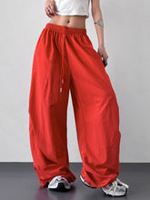 Bright red wide leg drawstring pants with loose fit and elastic waistband designed for comfortable wear