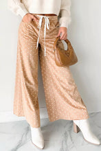 Beige polka dot print wide leg pants with drawstring waist offering comfortable and stylish casual wear