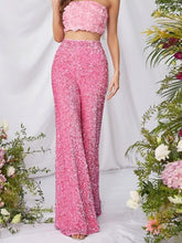 Pink sequin embellished wide leg pants featuring flare design perfect for stylish evening wear