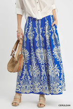 Blue maxi skirt with intricate white embroidered paisley patterns and border print wide leg design by umgee