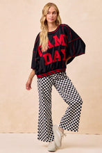 Black and red game day oversized sweatshirt with ruffled sleeves paired with bibi gameday checkered printed pants