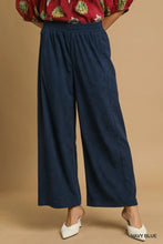 Navy blue umgee wide-leg corduroy pants featuring an elastic waistband for comfortable everyday wear