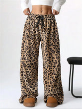 Leopard wide leg plush fleece lounge pants with cheetah print and a comfortable drawstring waistband