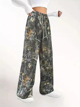 Relaxed fit camo print wide-leg pants with a drawstring waist for comfortable casual wear