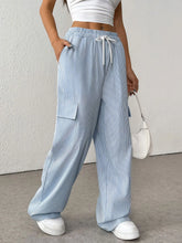 Light blue and white striped wide leg cargo pants with elastic waistband and drawstring striped wide leg design