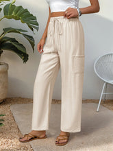 Cream-colored textured cotton drawstring wide leg pants with side pockets machine wash cold for easy care