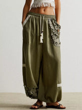 Olive green linen drawstring harem pants with lace trim and tassel for comfortable casual wear