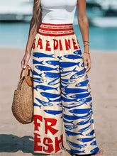 Plus size printed wide leg beige pants with bold blue fish print red saedines fresh lettering and red elastic waistband