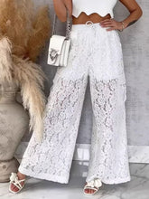 White lace wide-leg pants featuring a scalloped waistband and drawstring for an elegant lace wide-leg style