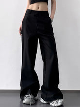 Black wide leg high waist trousers with a relaxed flared silhouette ideal for formal and casual wear