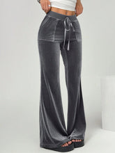 Gray velvet flare pants with drawstring waist and front pockets in soft velvet flare fabric for comfortable wear