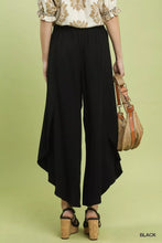 Black umgee flowy asymmetrical hem wide leg pants with high-waisted draped design and flowy asymmetrical hem