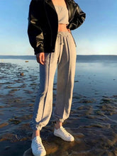 Gray casual drawstring jogger pants with elastic cuffs and side stripes for comfortable everyday wear