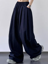 Dark navy wide-leg pants with elastic waistband designed for comfort and easy care, machine wash recommended