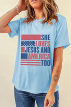 Light blue round neck short sleeve t-shirt with distressed flag graphic