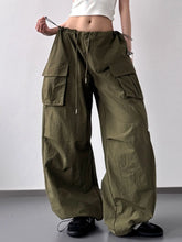 Olive green drawstring wide leg cargo pants with multiple large pockets and a comfortable waistband design