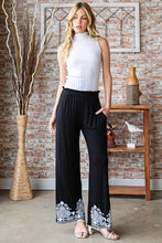 Black Heimish full size solid damask casual pants featuring wide-leg design and white embroidered cuffs detailing
