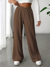 Brown wide leg high waist pants with elastic waistband designed for comfortable stylish wear