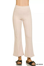 Sand beige heavy ponte pintuck pants with elastic waistband featuring smooth tailored fabric and side seam detailing