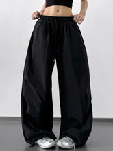 Black wide-leg pants with elastic waistband and drawstring detail from the back, letter back wide leg drawstring pants