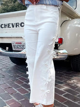 White wide-leg pants with bow accents and decorative side ties offering a perfect fit for stylish wear