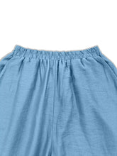 Light blue floral wide leg pants with elastic waistband and soft textured fabric for comfortable wear
