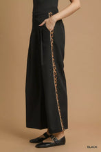 Black umgee wide-leg pants with front pleats and leopard print contrast trim offer stylish comfort