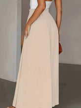 Beige high waist wide leg pants made from lightweight flowing fabric for a comfortable and stylish look