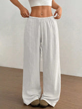 White wide leg drawstring casual pants with loose fit, drawstring waist, and subtle vertical pleats for comfort