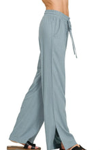Light blue zenana linen drawstring loose-fitting wide-leg pants with elastic waistband for comfortable wear