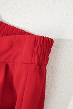 Red pleated loose straight pants with high elastic waist and pull on design for comfortable wear