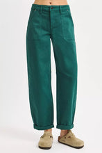 Emerald green risen high rise ankle cuffed barrel pants with wide legs rolled cuffs and multiple pockets