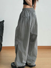 Gray wide leg drawstring casual pants with loose fit subtle texture and relaxed silhouette for everyday wear