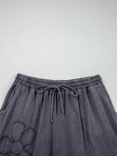 Dark gray flower patch mineral washed terry knit cropped wide leg pants with elastic waistband and embroidered paw print