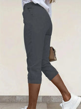 Dark gray pleated detail pants with tailored fit and side pockets made of breathable material composition, machine wash care instructions