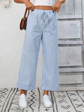 Light blue and white striped wide leg pants with a drawstring waistband for comfortable casual wear