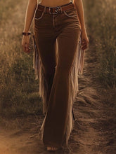 Brown flare pants with long fringe trim detailing along the sides in suede material for stylish wear
