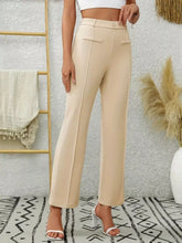 Beige high waist flare pants with tailored fit and subtle side seam detailing for a polished look