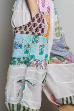 Pol printed patchwork wide leg pants featuring vibrant floral paisley striped fabrics with white canvas pockets and adjustable drawstring