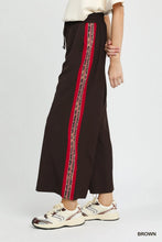 Umgee wide leg pants in brown with a bold red patterned contrast stripe down the side