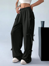 Black cargo wide leg pants with elastic waistband and side tie details perfect for casual wear