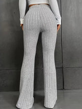 Plus size gray ribbed knit high waist flare pants showcasing a comfortable and stylish knit fabric design