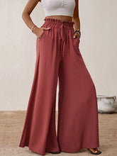 Rust-colored perfor frill tied wide leg pants with high waist drawstring waistband and side pockets for casual wear
