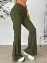 Olive green high waisted flare pants with ruched waistband designed for a stylish and comfortable fit