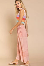 Pastel pink pol elastic waistband wide leg pants with drawstring and subtle geometric paneling for comfortable wear