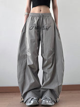 Gray drawstring oversized wide leg casual pants with black embroidered pussy girl script on front
