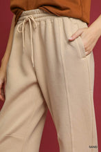 Umgee fleece jogger pants in beige with a drawstring waist allow and side pockets for comfortable wear