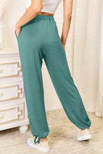 Teal basic bae full size soft rayon drawstring waist pants with pockets featuring elastic waistband and drawstring cuffs